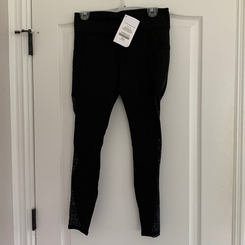 Fabletics black leggings with lace side and pockets NWT